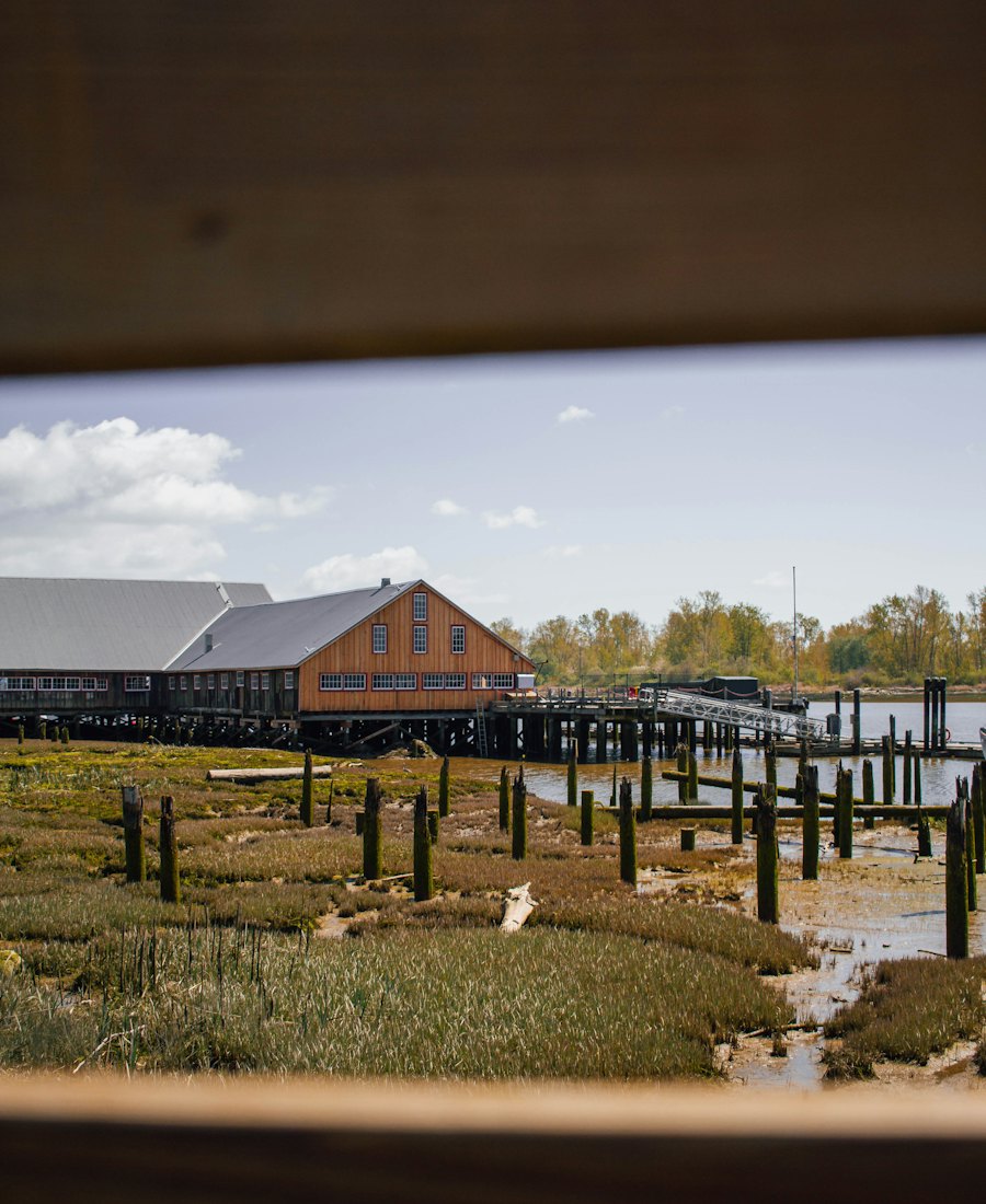 Cannery buildings on stilts over the tideflat.