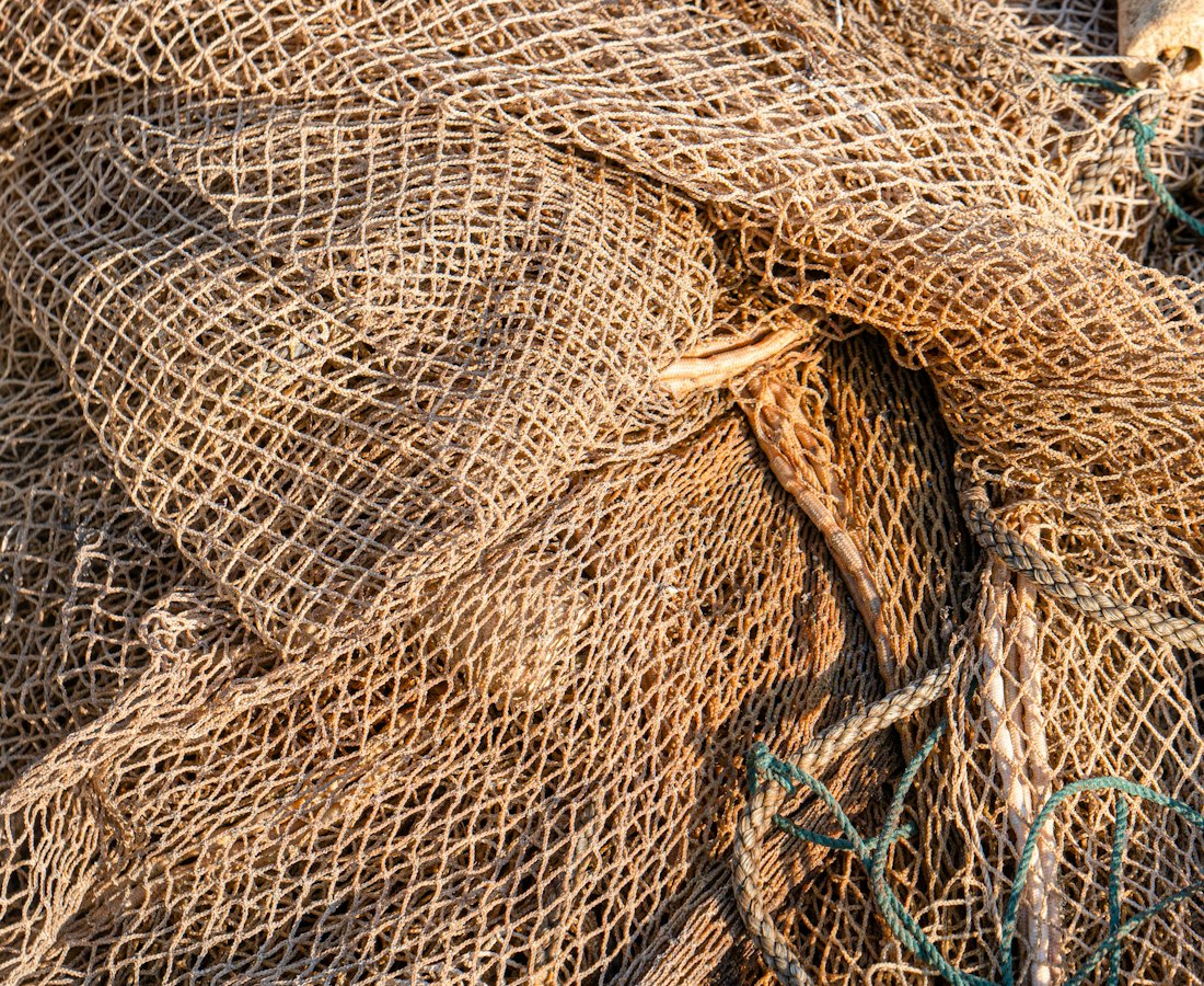 A heap of gillnet on the loft floor.